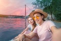 happy girl friends taking selfie photo on a bank of Saone river in Lyon Royalty Free Stock Photo