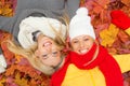 Two happy girlfriends laying on the ground Royalty Free Stock Photo