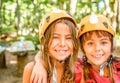 Two happy girlfriends smiling in the adventure park Royalty Free Stock Photo