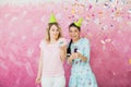 Two happy girls celebrate birthday party with cupcake confetti a Royalty Free Stock Photo