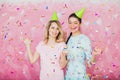 Two happy girls celebrate birthday party with cupcake confetti a Royalty Free Stock Photo