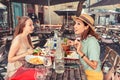 happy girls friends have a fun conversation and talking while a little meal in a terrace restaurant outdoors Royalty Free Stock Photo