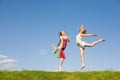 Two happy girls jumping Royalty Free Stock Photo