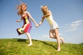 Two happy girls jumping Royalty Free Stock Photo