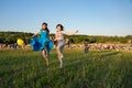Two happy girls jumping high in blue sky on summer Royalty Free Stock Photo
