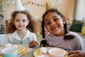 Two happy girls looking at camera birthday party and smiling Royalty Free Stock Photo