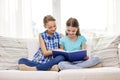 Two happy girls reading book at home Royalty Free Stock Photo