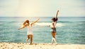 Two happy girls sea beach fun Royalty Free Stock Photo