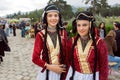 Two happy girls in traditional Georgian costumes ready for performance during party on the City Day