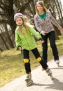 Two happy grils on roller-skates