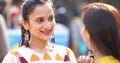 Two women having fun at Surajkund Mela