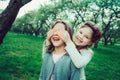 Two happy kid girl playing together in summer, outdoor activities Royalty Free Stock Photo