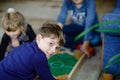 Two happy kids boys playing table soccer with friends at home. Smiling child having fun with board football, indoors Royalty Free Stock Photo