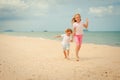 Two happy kids playing at the beach Royalty Free Stock Photo