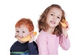 Two happy kids talking on banana phones Royalty Free Stock Photo