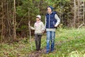 Two happy kids walking along forest path Royalty Free Stock Photo