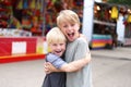 Two Happy Little Boys Hugging and Smiling at Small Town American Royalty Free Stock Photo