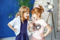Two happy little children sing a song in karaoke. The concept is Royalty Free Stock Photo