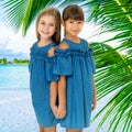 Two happy little girls posing on tropical beach Royalty Free Stock Photo