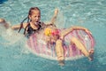 Two happy little kids playing in the swimming pool Royalty Free Stock Photo