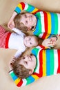 Two happy little preschool kids boys with newborn baby girl Royalty Free Stock Photo