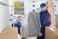 Two Movers Unloading Furniture From Truck Royalty Free Stock Photo