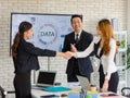 Two happy millennial professional successful businesswomen in formal suit standing shaking hands greeting together when business Royalty Free Stock Photo