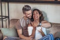 Two happy mixed race couple having fun at the coffee shop. Royalty Free Stock Photo