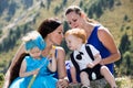 Two happy moms and children girl and boy hugging on nature Royalty Free Stock Photo