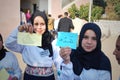 Two Happy Muslim girls holding arabic words Royalty Free Stock Photo