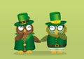 Two happy owls in national costume at Patrick`s Day holding hands