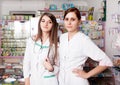 Two happy pharmacist young women Royalty Free Stock Photo