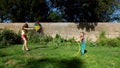 Two happy sisters playing with garden watering