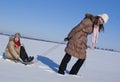 Two happy sisters sledding Royalty Free Stock Photo