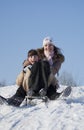 Two happy sisters sledding Royalty Free Stock Photo