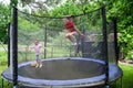 Two happy sisters on trampoline