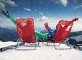 Two happy skiers on the top of mountain