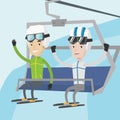 Two happy skiers using cableway at ski resort.