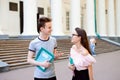 Students walking and having a talk near old campus