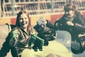 Two happy teen girls driving a bumper cars Royalty Free Stock Photo