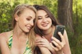 Two happy teenage girls taking selfshot or selfy picture of them Royalty Free Stock Photo