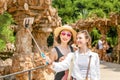 Happy traveler women tourist enjoying great view and taking selfie in famous Guell park in Barcelona Royalty Free Stock Photo