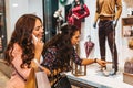 Two happy women with shopping bags enjoying in shopping, having fun in the city Royalty Free Stock Photo