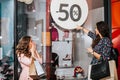 Two happy women with shopping bags enjoying in shopping Royalty Free Stock Photo