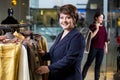 Two happy women shopping in clothes store Royalty Free Stock Photo