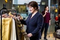 Two happy women shopping in clothes store Royalty Free Stock Photo