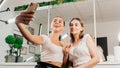 Women take a selfie in a beauty salon