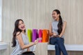 Two happy women using shopping on mobile phone and tablet. Two young women smiling shopping. Female working with tablet using Royalty Free Stock Photo