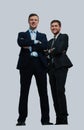 Two happy young businessmen full body, isolated on white. Royalty Free Stock Photo