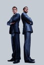 Two happy young businessmen full body, isolated on white. Royalty Free Stock Photo